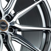 A multi-spoke alloy wheel features a polished, intricate design with the central cap displaying the text "VOSSEN Hybrid-Forged," set against a white background.