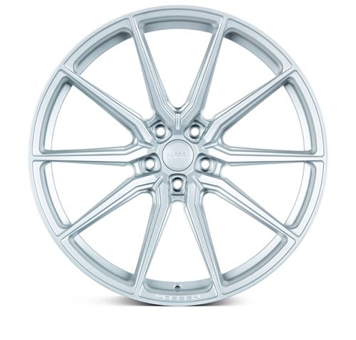 A silver alloy wheel features ten thin, double spokes extending from the central hub. The hub displays the text "BBS FORGED." The wheel is isolated with a white background.