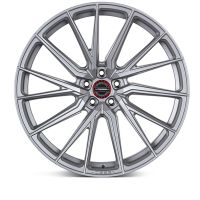 A silver alloy wheel features a multi-spoke design, showing off its intricate pattern. At the center is a round emblem with the text "VOSSEN FORGED."