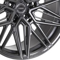 A detailed alloy wheel with a complex spoke design, featuring the text "VOSSEN" on the center cap and rim, positioned against a plain white background.