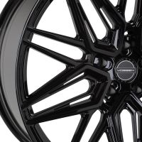 A glossy black alloy wheel features a complex multi-spoke design, prominently displaying the brand name "VOSSEN" at its center, set against a plain white background.