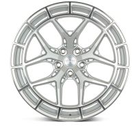 A silver alloy wheel featuring an intricate, multi-spoke design. Text in the center: "VOSSEN FORGED." The word "VOSSEN" is also embossed at the bottom. The background is plain white.