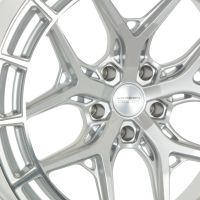 A silver alloy wheel with intricate spoke design features the text "VOSSEN HYBRID FORGED" at the center, set against a plain white background.