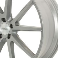 A silver alloy car wheel with multiple spokes and a central hubcap reading "VOSSEN HYBRID FORGED," shown against a plain white background.