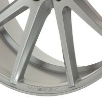 A sleek, silver alloy wheel with five spokes; embossed with "VOSSEN" on the rim, angled against a white background for display.