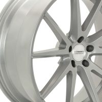 A metallic silver alloy wheel with ten spokes radiates from the center hub. The center cap features the text "VOSSEN HYBRID FORGED." The background is plain white.