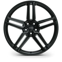 A black alloy wheel with a five-double-spoke design rests against a plain white background. Center text reads: "VOSSEN FORGED."