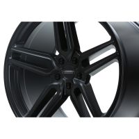 A black alloy wheel with a multi-spoke design, featuring the branding "VOSSEN HYBRID FORGED" at the center, is displayed against a plain white background.