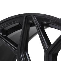Black metallic wheel rim features triangular spokes, labeled "VOSSEN" and "HF-2," displayed in close-up view, highlighting modern design elements and smooth finish.
