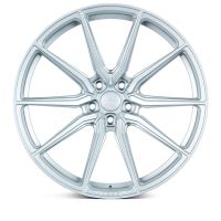 A silver alloy wheel with multiple thin spokes radiates symmetrically from the center. Text on the hub reads "OE Tuning Wheels," set against a plain white background.