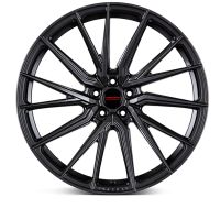 A black alloy wheel with a multi-spoke design sits against a plain white background. The center features a small red and black emblem with the word "Vossen."