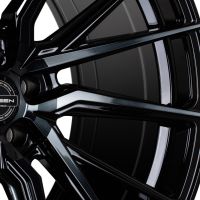 A glossy black Vossen wheel with a multi-spoke design, featuring text: "VOSSEN HYBRID FORGED," and "MISSION PERFORMANCE PRECISION," on the center cap, set against a plain background.
