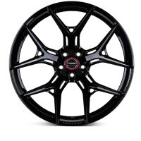 A glossy black alloy wheel with a multi-spoke design features the text "VOSSEN" on a red and silver center cap. It is displayed on a plain white background.