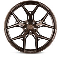 Bronze alloy wheel with intricate, multi-spoke design sits against a white background. Central hub displays text: "HRE" and "0861FM."