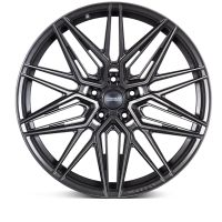 A black, multi-spoke alloy wheel with a starburst design, set against a white background. Center cap text: "VOSSEN FORGED." Rim edge text: "VOSSEN."
