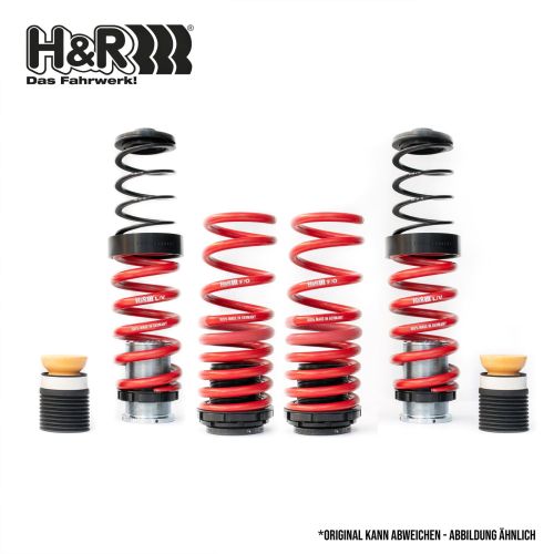 Car suspension springs stand upright, featuring black and red coils with rubber bump stops, arranged on a white background. Text includes: "H&R Das Fahrwerk! H&R F/O 100% MADE IN GERMANY H&R/F/0 *ORIGINAL KANN ABWEICHEN - ABBILDUNG ÄHNLICH."